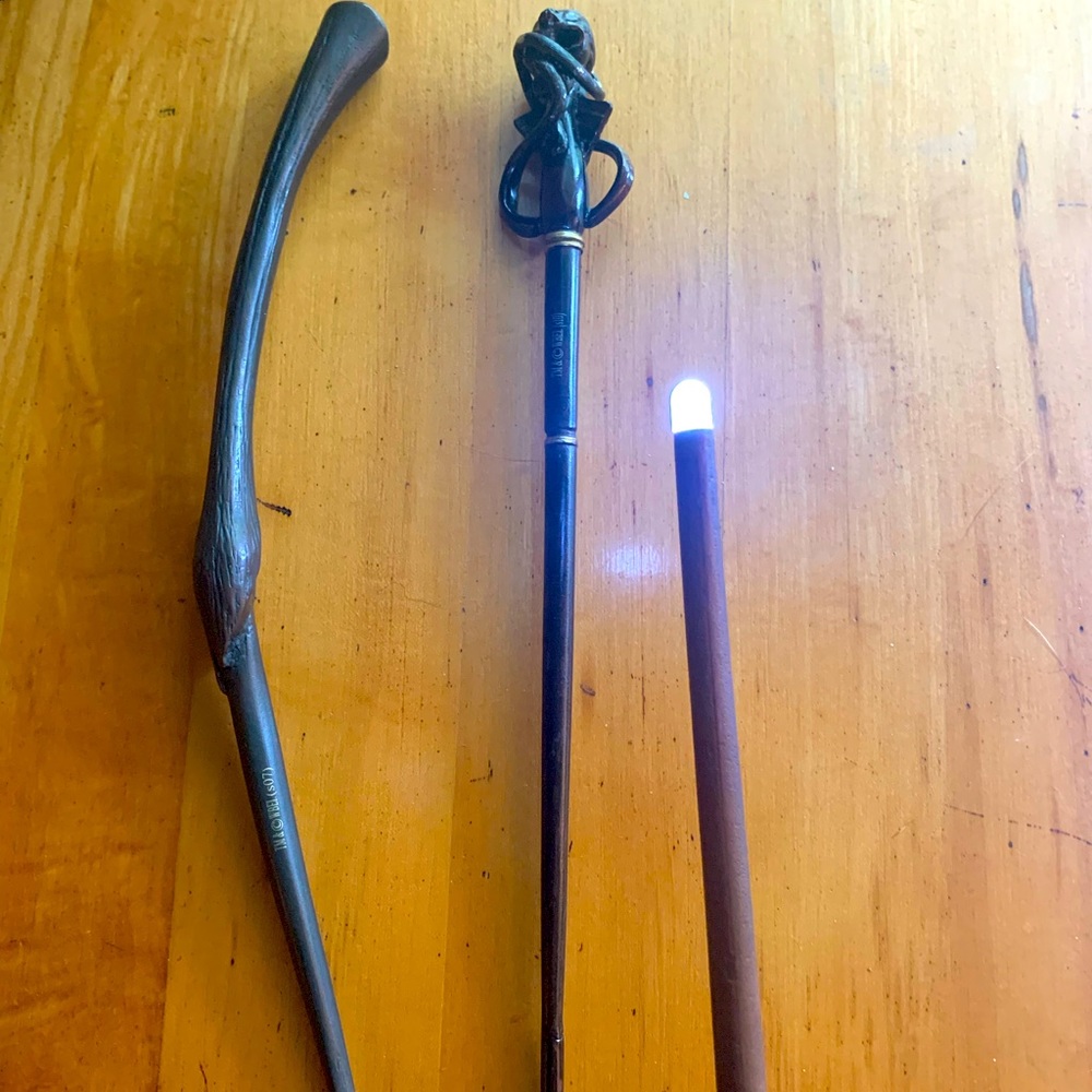 The Noble Collection Harry Potter Wands. 1 light up, 2 just prop replica.